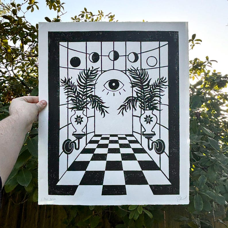 behind the door moons and palms, thin black perspective lines cross over each other. the vertical lines are straight but horizontal lines curve, giving the impression that the room is rounded. the effect is visual symmetry but vestibular uneasiness