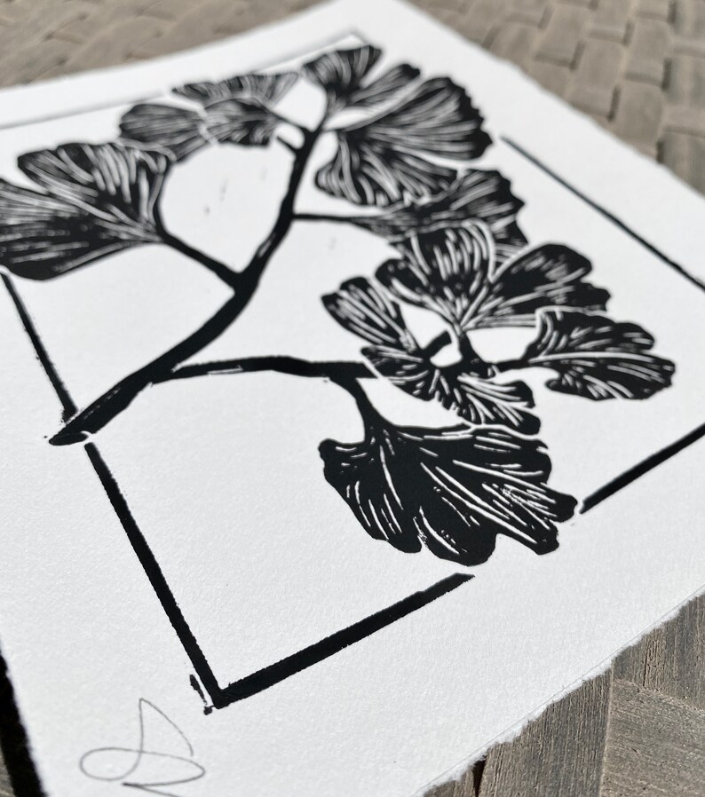 a close-up of the print. the authors signature is in the bottom right corner of the print. the edges of the print are torn for a natural rustic look.