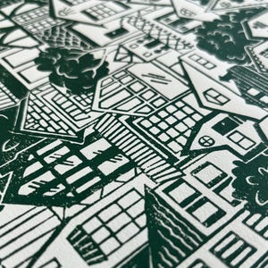 An angled close-up showing the texture of the paper and how the ink sits on top of it, creating a finely speckled effect in a few places on the print. This effect adds to the handmade one-of-a-kind quality of the print