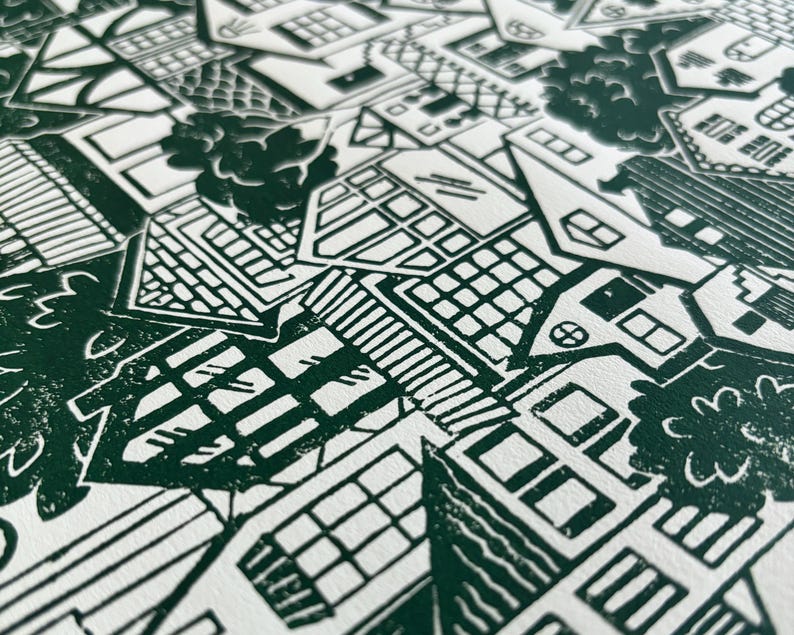 An angled close-up showing the texture of the paper and how the ink sits on top of it, creating a finely speckled effect in a few places on the print. This effect adds to the handmade one-of-a-kind quality of the print