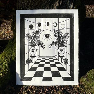 there is a 1 inch thick black border around the print and the checkerboard floor pattern extends past it along the bottom of the print. 
the paper edges are torn for a rustic natural look.