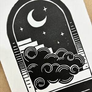 Straight-on closeup of the nighttime side. The cloud looks like it is billowing in front of the staircase from inside the portal arch. The edges of the paper are torn rather than cut, giving a rustic artful look.