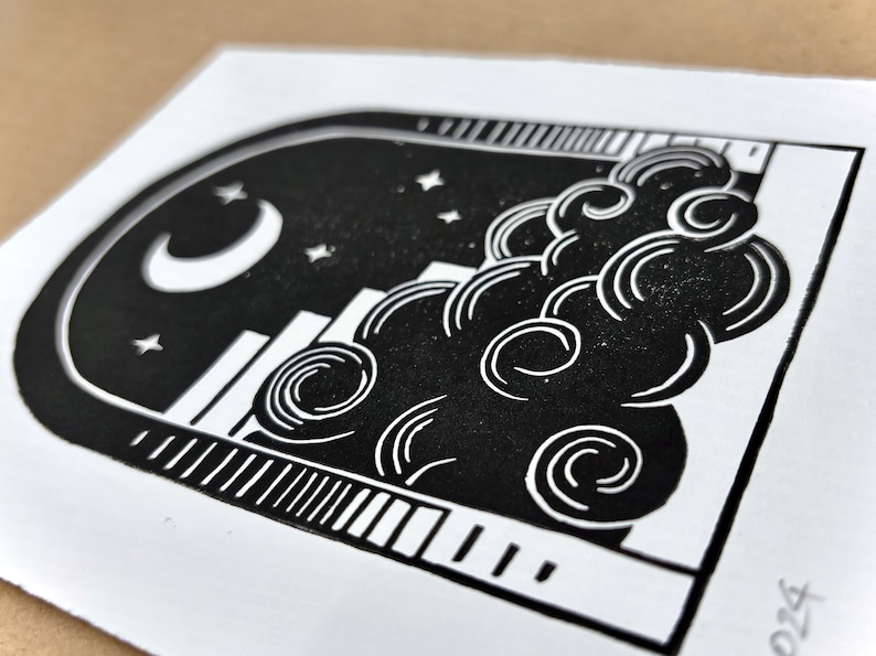 Angled close-up of the nighttime archway print. Five small pointy stars sit around the moon, which is in the center of the sky under the arch. The cloud has curling white lines on it, like those on the sun.