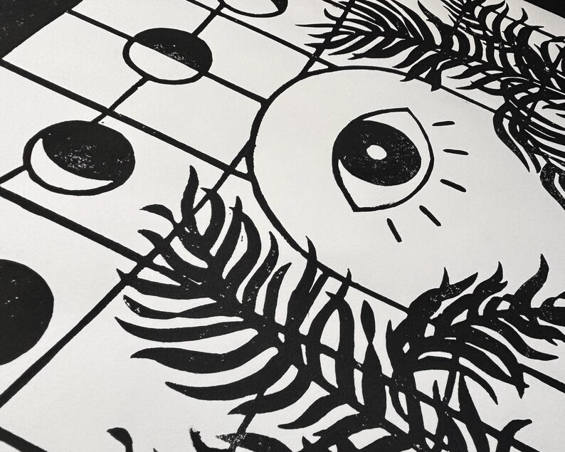 closeup of the top half. each palm frond has dozens of leaves twisting over each other and reaching in front of the door slightly. the paper texture is visible, with speckles of white showing through the black ink, adding to the handmade look