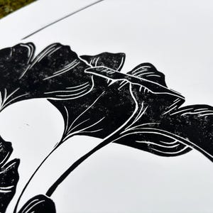 the paper and ink texture is visible, showing a few white speckles on the leaves and branch. this enhances the handmade look of the print.