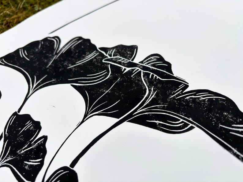 the paper and ink texture is visible, showing a few white speckles on the leaves and branch. this enhances the handmade look of the print.