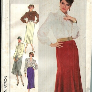 May include: Simplicity sewing pattern envelope. The front features a woman in a white blouse and red skirt. The envelope has the number 7604 and size 10. Includes illustrations of different outfit options.