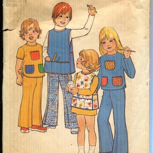 May include: Vintage Simplicity sewing pattern envelope featuring illustrations of children in colorful outfits. The envelope has the number 7103 and the Simplicity logo. The price is $1.15.