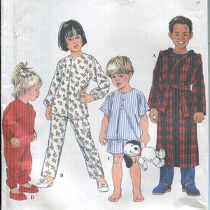 May include: Simplicity pattern envelope featuring children's sleepwear designs. The envelope displays illustrations of children in pajamas, a robe, and a jumpsuit. The pattern number is 8493, and the size is BB.