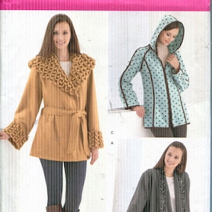 May include: A rustic wooden sign with the text "Welcome to our home" in white lettering. The sign features a distressed finish and a simple, inviting design, perfect for front door decor.