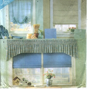 May include: Simplicity 8353 Home sewing pattern envelope for classic shades and valances. The front features illustrations of blue and beige window treatments, including a gathered valance and roman shades, with the text Simplicity Home.