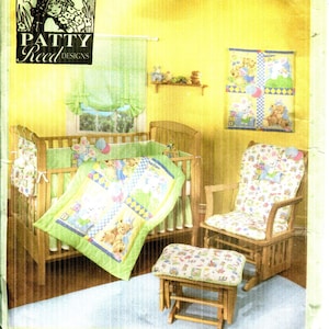 May include: Simplicity pattern 4576 for a baby nursery set. The image shows a crib, rocking chair, and ottoman with a matching quilt and accessories. The set features a teddy bear and bunny theme.