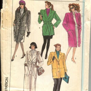 May include: Vintage Simplicity pattern envelope featuring illustrations of women's coats and jackets. The envelope displays the number 8872 and size 12. The design includes a houndstooth coat, a green belted jacket, a pink coat, a white coat, and a yellow jacket.