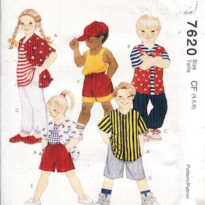 May include: McCall's sewing pattern featuring children's clothing designs. The illustration shows various outfits, including shorts, shirts, and a tank top. The pattern includes sizes CF (4, 5, 6). The cover has the text "Easy McCall's" and a price of $8.50.