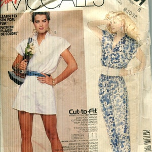 May include: McCall's Easy sewing pattern number 2391 for a combination series of sizes 8-10-12. The pattern is for a cut-to-fit design, with instructions for adjusting the pattern to fit different sizes. The pattern includes two different styles: a white short dress with a collar and a blue and white patterned dress with a collar.