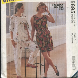 May include: McCall's sewing pattern envelope featuring two women modeling clothing. One wears a floral print dress, the other a pajama set. The envelope includes the text "GITANO" and "LEARN TO SEW FOR FUN". The size is medium.