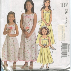 May include: A sewing pattern for a sleeveless dress with a floral print. The pattern is for sizes 7-8, 10-12, and 14. The pattern is from McCall's and is called Easy McCall's M5309.