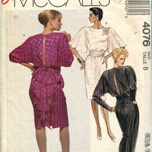 May include: McCall's 4076 sewing pattern envelope for size 8. The front displays illustrations of three garments: a purple polka-dot dress with a back cutout, a white dress with wide sleeves and a floral accent, and a black jumpsuit with a back cutout.