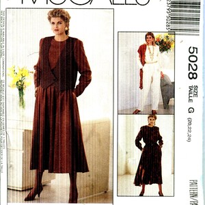 May include: McCall's 5028 sewing pattern envelope featuring a brown long-sleeved dress and a matching vest. The front shows a model wearing the outfit, with additional photos of variations in white and brown. Text includes Easy McCall's, 5028, and Woman's Day Collection.