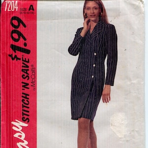 May include: A vintage McCall's sewing pattern, featuring a woman in a navy blue pinstripe dress with white buttons. The pattern is labeled "Easy Stitch 'N Save" and includes the number 7204 and size A (8-10-12-14).
