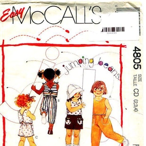 May include: A McCall's 4805 sewing pattern envelope for children's clothing titled Jumping Beans. The front features illustrations of four children wearing various outfits including a polka dot romper, striped overalls, a top with shorts, and a jumpsuit.