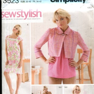 May include: Simplicity sewing pattern 3523, size H5, featuring a pink jacket, dress, and suit designs. The pattern includes sizes 6, 8, 10, 12, and 14. The image also shows the Simplicity logo and the text "sew stylish".