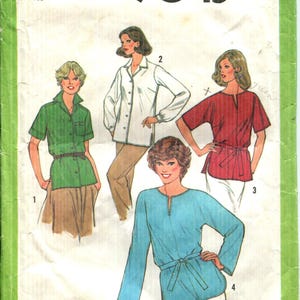May include: Vintage Simplicity sewing pattern 9045, size 14 Miss. The pattern features illustrations of four different blouses. The blouses are in green, white, red, and blue. The pattern is on a green and white background.