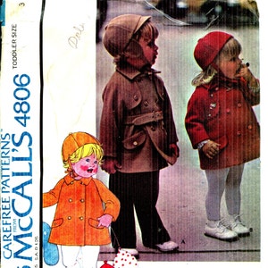 May include: Vintage McCall's 4806 sewing pattern for toddler coats and hats. The pattern shows illustrations of children in coats and hats. The pattern envelope is in shades of orange, brown, and red.