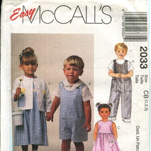 May include: McCall's sewing pattern 2033 for children's clothing. The pattern features a dress, overalls, and a jacket. The children's clothing is in sizes CB (1,2,3). The pattern includes the text "Easy McCall's".