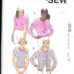 May include: Kwik Sew pattern 2415 featuring illustrations of women's tops and cardigans. The pattern includes sizes XS to XL. The cover displays the Kwik Sew logo and the designer's name, Kerstin Martensson.