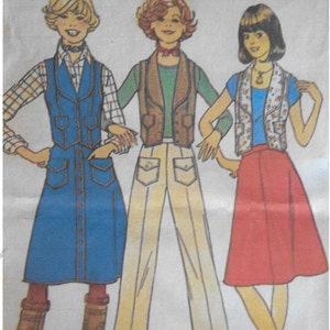 May include: Illustration of three outfits from a vintage sewing pattern. The outfits include a blue denim dress with a vest, a green shirt with a brown vest and tan pants, and a blue shirt with a floral vest and a red skirt. Text at the top reads "Young Junior/Leese 9/10 Cut".
