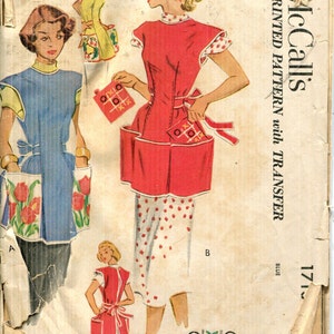May include: Vintage sewing pattern for a red and white apron with pockets. The pattern includes a transfer for a tic-tac-toe game. The pattern is for sizes 14-16 and is McCall's pattern number 171.