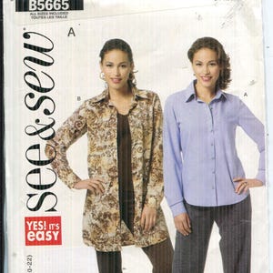 May include: A sewing pattern package featuring two women's fashion designs. One woman is wearing a long-sleeved, button-down shirt in a light blue color. The other woman is wearing a long-sleeved, collared shirt with a floral pattern.