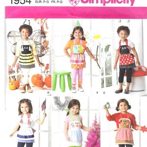 May include: Simplicity pattern 1954 for children's aprons. The package features various apron designs, including a bee, a ladybug, and a gingerbread person. The aprons are shown on children. The package also includes the Simplicity logo.