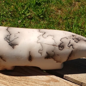 Stylized polar bear in porcelain terra sigillata and raku firing
