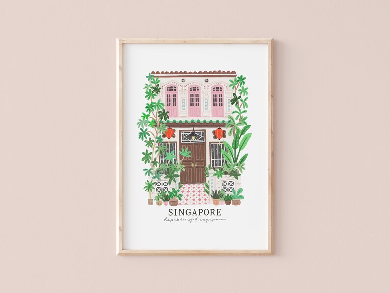 May include: A framed illustration of a pink and white building with a brown door and green plants. The text "SINGAPORE" and "Republic of Singapore" is below the building.
