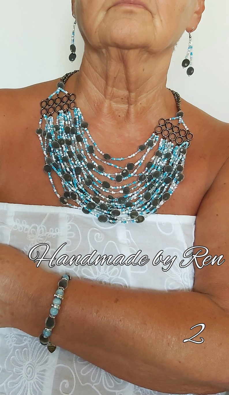 Handmade set of necklace, earrings and bracelet made of velvet seeds / black pearl seeds / mgambo tree seeds and other components #2 White/turquoise