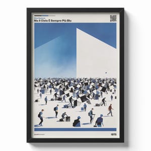 May include: Framed art print with a blue and white illustration. The artwork shows figures among geometric shapes, with text at the top reading "Ma Il Cielo È Sempre Più Blu" and the year 1975 at the bottom. The print is in a black frame.