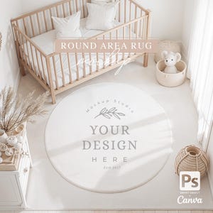 May include: A white round area rug with the text "Your Design Here" and "Mockup Studio Est 2017" in a gray font. The rug is on a white floor in a nursery with a wooden crib and a stuffed animal in a basket.