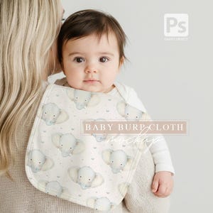 May include: A baby burp cloth featuring a repeating pattern of watercolor elephants and small hearts on a cream background. The text "BABY BURP CLOTH" is displayed in a rectangular box. The baby is wearing a white onesie.