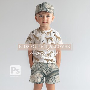 May include: A white t-shirt with a leopard print design, green and white patterned shorts, and a green and white patterned cap.  Kids Outfit Allover Mockup PNG.