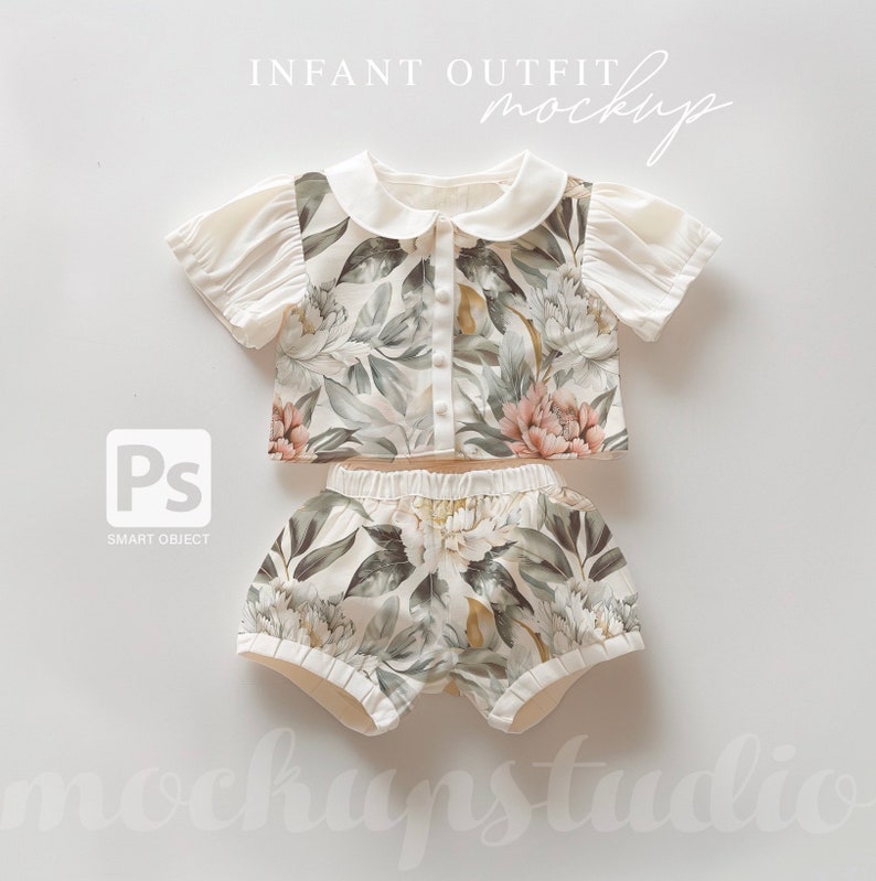 May include: A white and green floral print baby outfit with a collared top and matching shorts. The top has a button closure and the shorts have an elastic waistband. The outfit is laid flat on a white background.  INFANT OUTFIT MOCKUP is written in white text above the outfit.