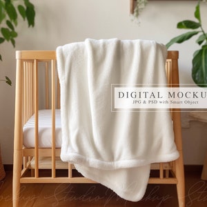 May include: White plush blanket draped over a wooden crib with a white sheet. The crib is in a room with a plant and a wooden side table. The text "DIGITAL MOCKUP JPG & PSD with Smart Object" is on a white rectangle.