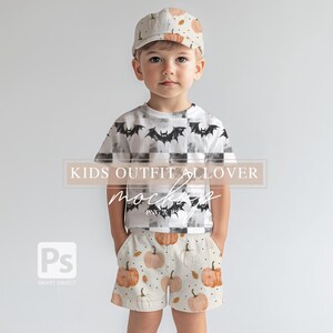 May include: A child's outfit mockup featuring a white t-shirt with a black bat print and white and black checkered pattern, pumpkin print shorts, and a white baseball cap with a pumpkin print. "KIDS OUTFIT ALLOVER MOCKUP PNG & PS" text is visible on the image.