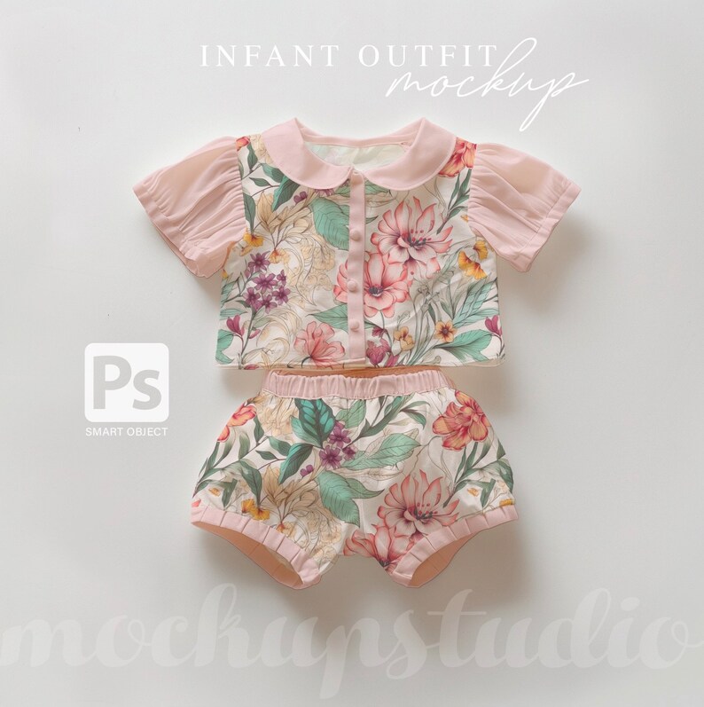 May include: A pink and white floral print baby outfit with a collared top and bloomers. The top has a button closure and short sleeves. The bloomers have a ruffled hem.