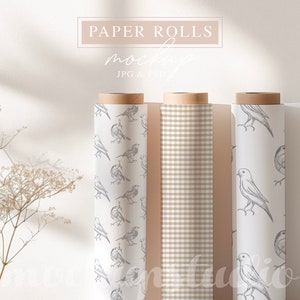 May include: Three rolls of wrapping paper, one with a brown and white gingham pattern, one with a white background and a repeating pattern of small birds, and one with a white background and a repeating pattern of larger birds.