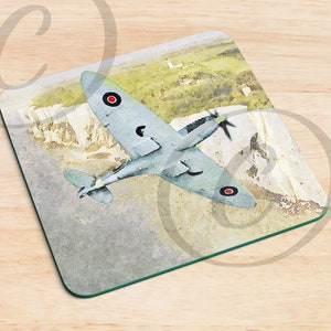 May include: A watercolor painting of a gray and white airplane flying over a white cliff. The airplane has red circles on the wings.