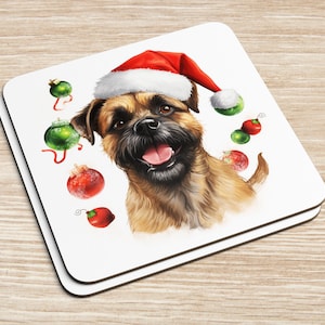 May include: A brown and tan dog wearing a red Santa hat with green and red Christmas ornaments around it.