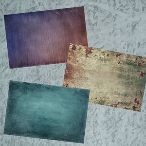 May include: Three rectangular textured paper backgrounds in different colors. The top background is a purple and brown gradient. The bottom left background is a teal blue. The bottom right background is a light brown with red rust spots.