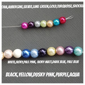 May include: Two strands of round beads in various colors including fuchsia, aubergine, silver, lime green, gold, turquoise, shocking pink, white, ivory, pale pink, dark blue, pale blue, black, yellow, dusky pink, purple, and aqua on thin wire.